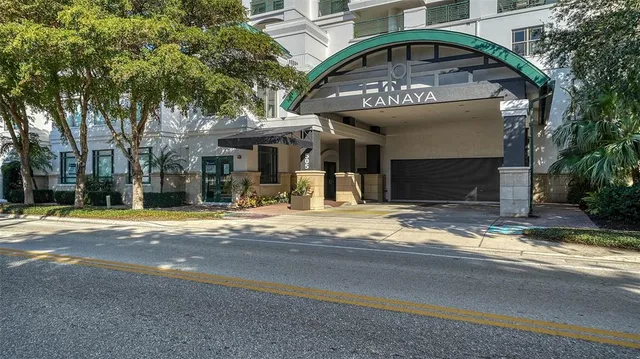 a view of a house with a outdoor space and a tree