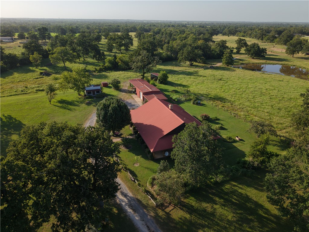 16403-16515 Macey Road Hearne, TX 77859 - Photo 15 of 46 an aerial view of residential house with outdoor space and river view