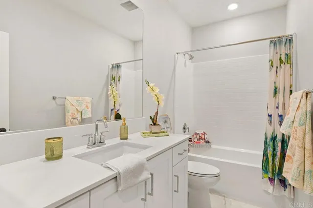 a work room with furniture and painting on the wall