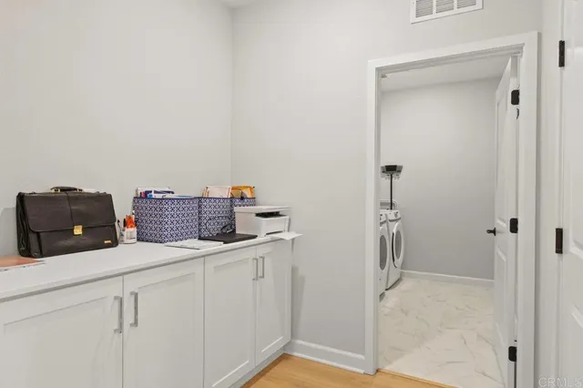 a bedroom with a bed and a lamp