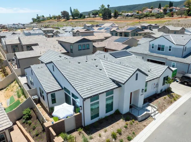 an aerial view of a house with a garden