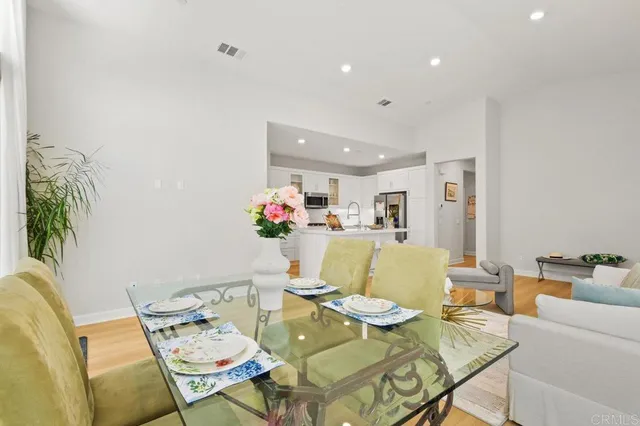 a living room with furniture and flowers