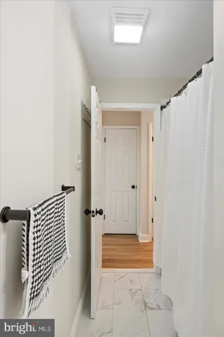 a spacious bedroom with a bed and a window