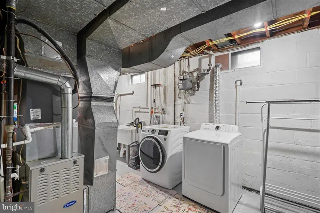 a balcony with wooden floor table and chairs