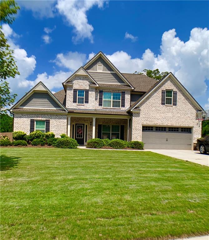 1549 Middleton Drive Monroe, GA 30655 - Photo 1 of 1 a front view of a house with a garden