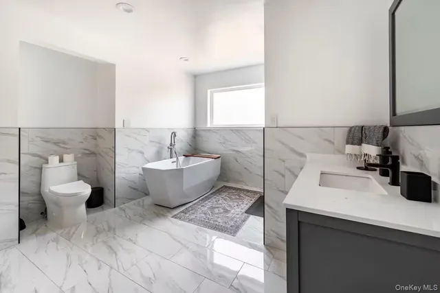a bathroom with a glass door shower