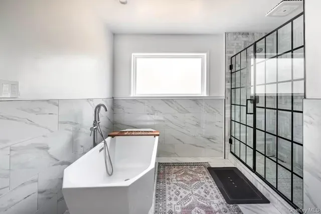 a room with furniture and a flat screen tv