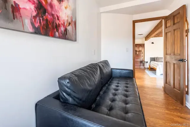 a view of a chairs and table in the balcony