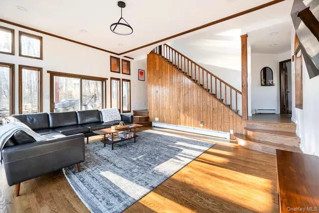 a kitchen with stainless steel appliances granite countertop a sink a stove and chairs