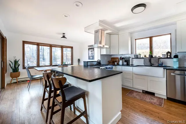 a bathroom with a toilet a sink and shower
