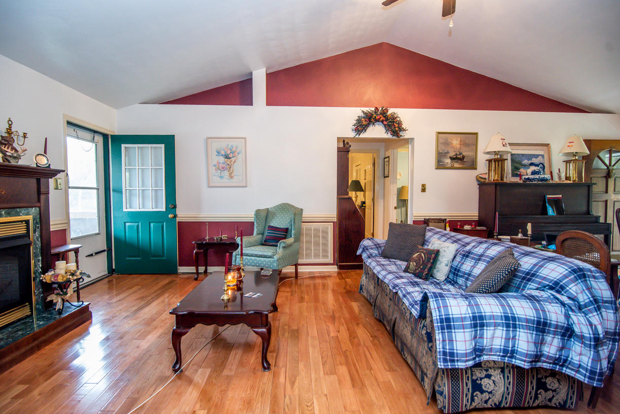 1057 Carroll Road Goodview, VA 24095 - Photo 14 of 46 a living room with furniture and a wooden floor
