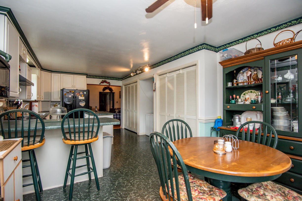 1057 Carroll Road Goodview, VA 24095 - Photo 4 of 46 a dining room with furniture and wooden floor