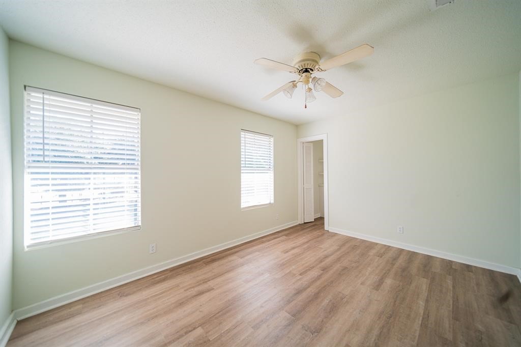 5400 Sheldon Street Houston, TX 77008 - Photo 15 of 18 a view of an empty room with a window and wooden floor