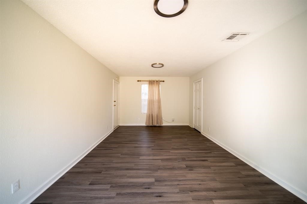 5400 Sheldon Street Houston, TX 77008 - Photo 2 of 18 a view of an empty room with wooden floor and window