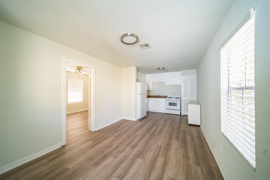 5400 Sheldon Street Houston, TX 77008 - Photo 5 of 18 a view of empty room with wooden floor and window