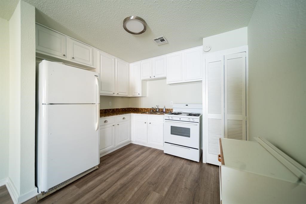 5400 Sheldon Street Houston, TX 77008 - Photo 6 of 18 a white refrigerator freezer sitting inside of a kitchen