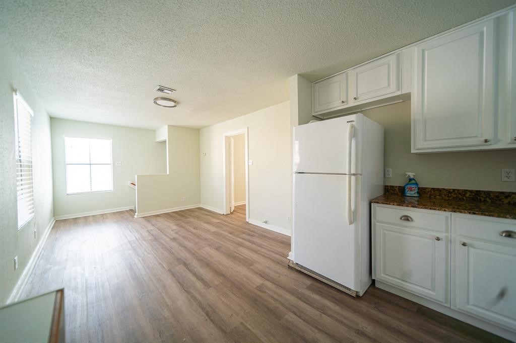 5400 Sheldon Street Houston, TX 77008 - Photo 8 of 18 a white refrigerator freezer sitting in a kitchen