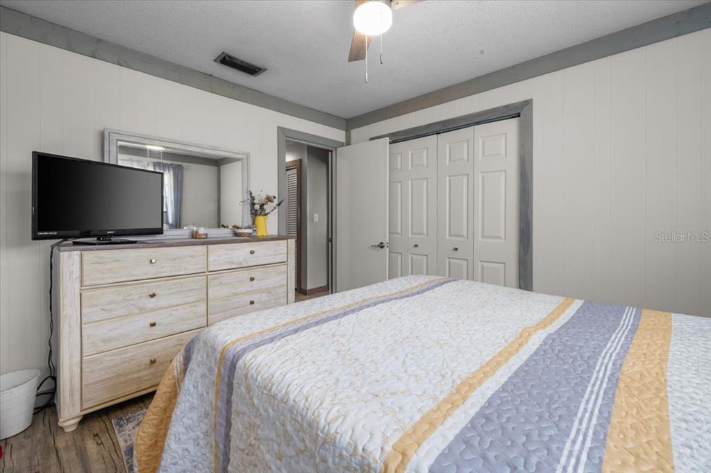 7422 County Road 231 Lake Butler, FL 32054 - Photo 33 of 57 a bedroom with a bed and a flat screen tv