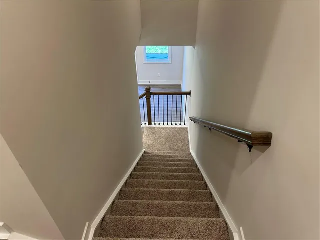 a view of a room with window and wooden floor