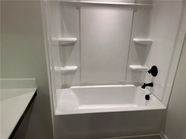 a front view of a building with a yard