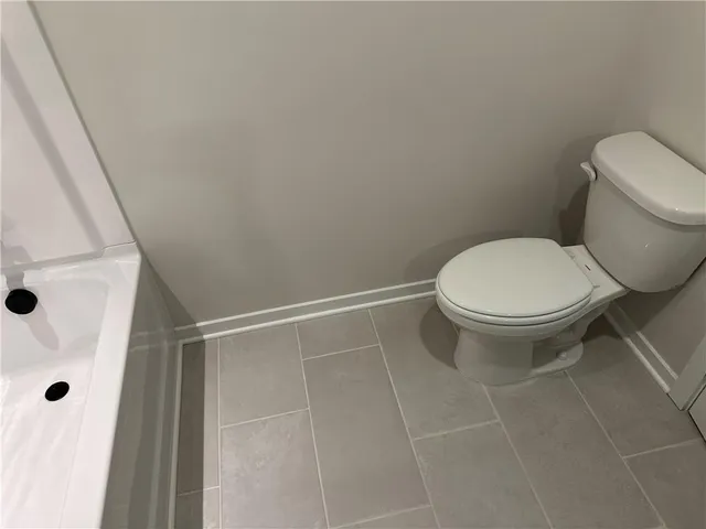 a front view of a building with garden