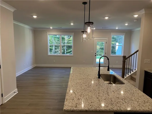 a view of entryway with wooden floor and stairs