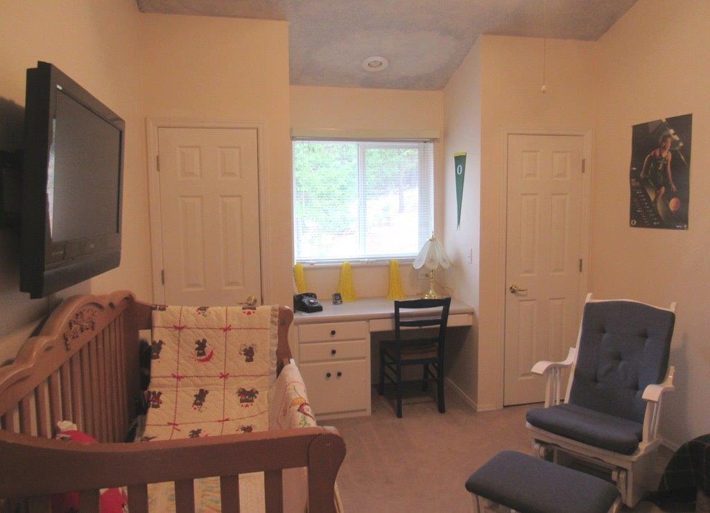 1961 Crow Road Merlin, OR 97532 - Photo 15 of 35 a living room with furniture and a flat screen tv