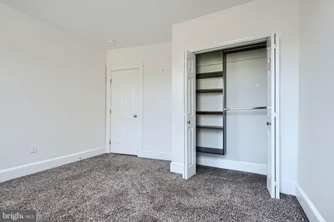 a view of an empty room with a hallway