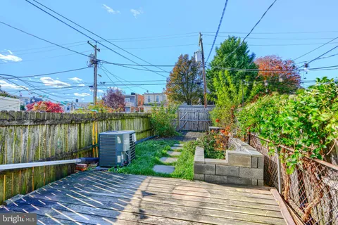 a view of a garden with sitting area
