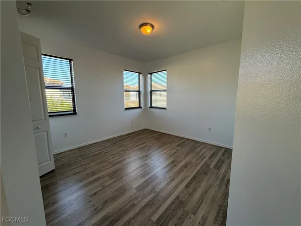 an empty room with windows