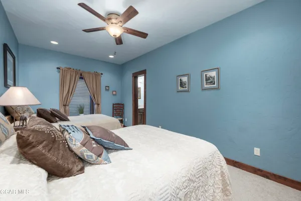 a bed room with a bed and a chandelier