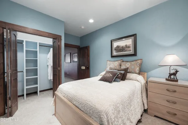 a bedroom with bed and window