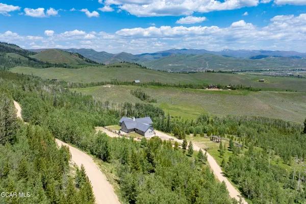 a view of a swimming pool with a yard