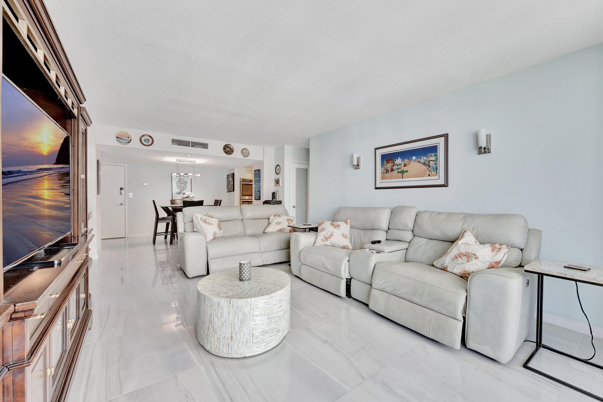 1900 South Ocean Boulevard, Unit 8G Pompano Beach, FL 33062 - Photo 11 of 54 a living room with furniture and a flat screen tv