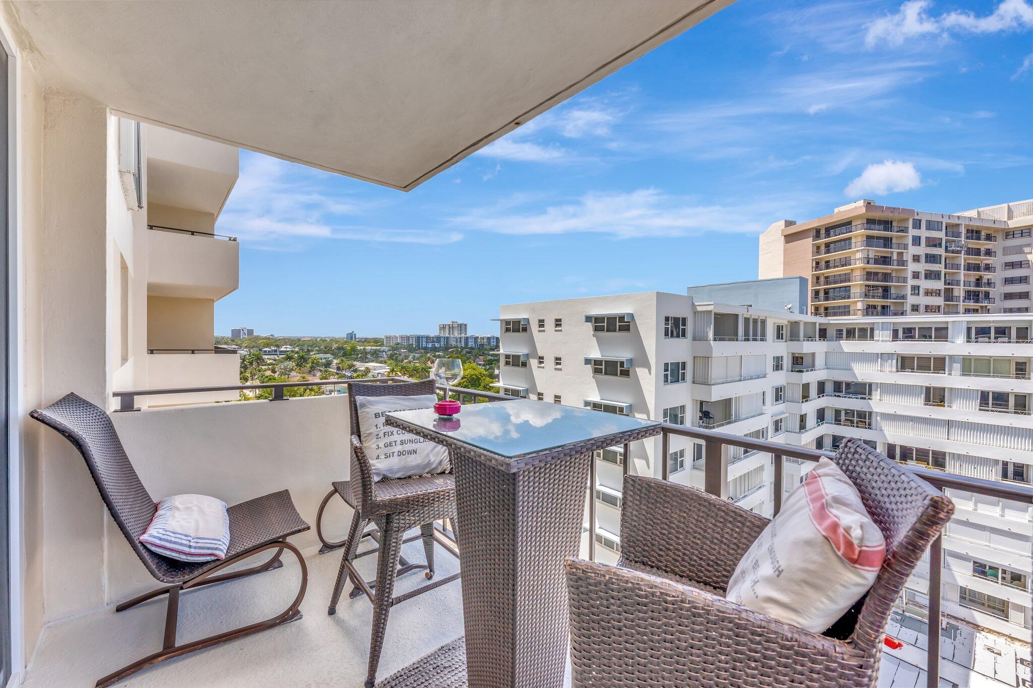 1900 South Ocean Boulevard, Unit 8G Pompano Beach, FL 33062 - Photo 16 of 54 a view of a dining room with furniture and a floor to ceiling window