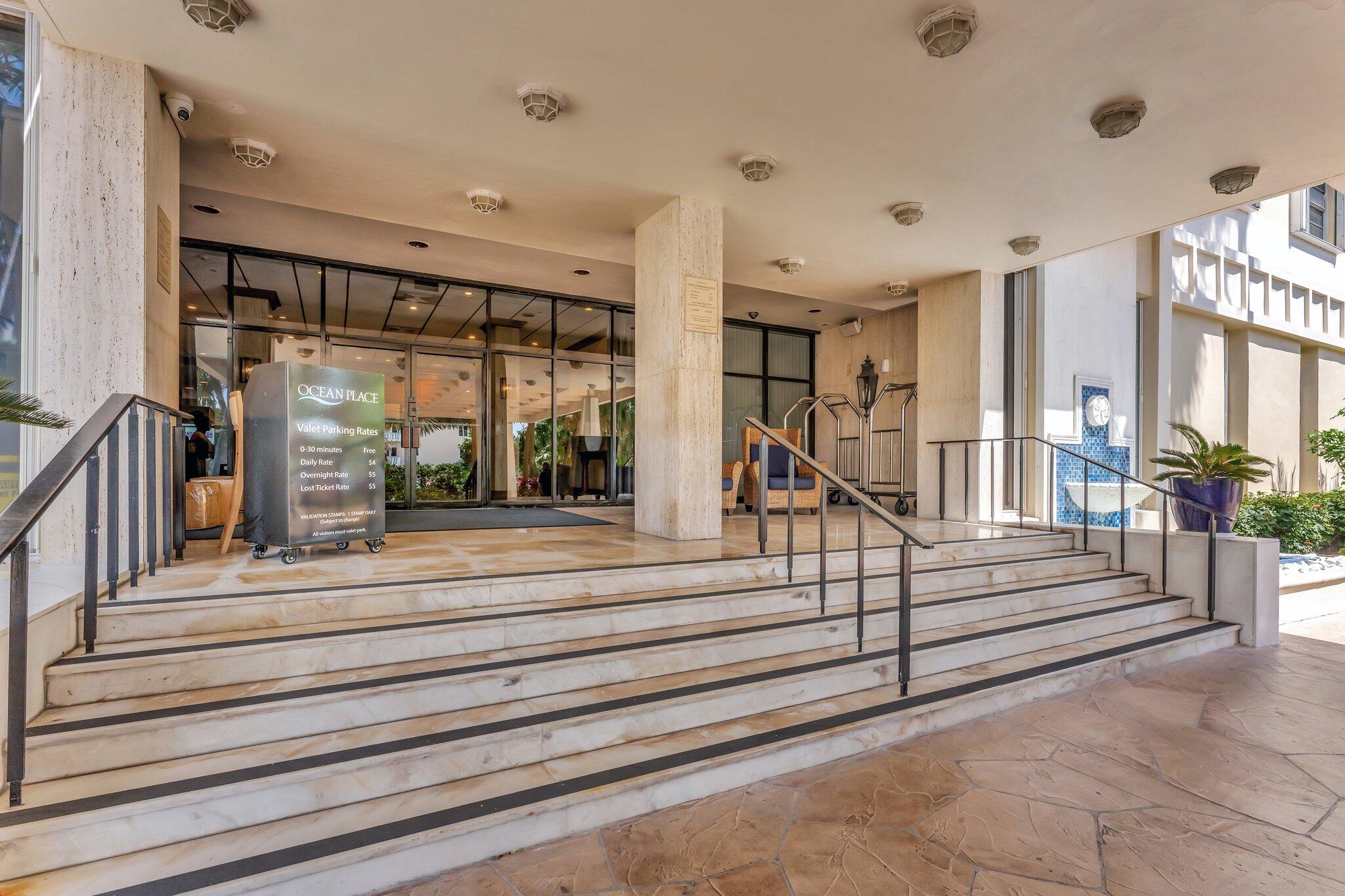 1900 South Ocean Boulevard, Unit 8G Pompano Beach, FL 33062 - Photo 35 of 54 a view of staircase and living room with floor to ceiling windows