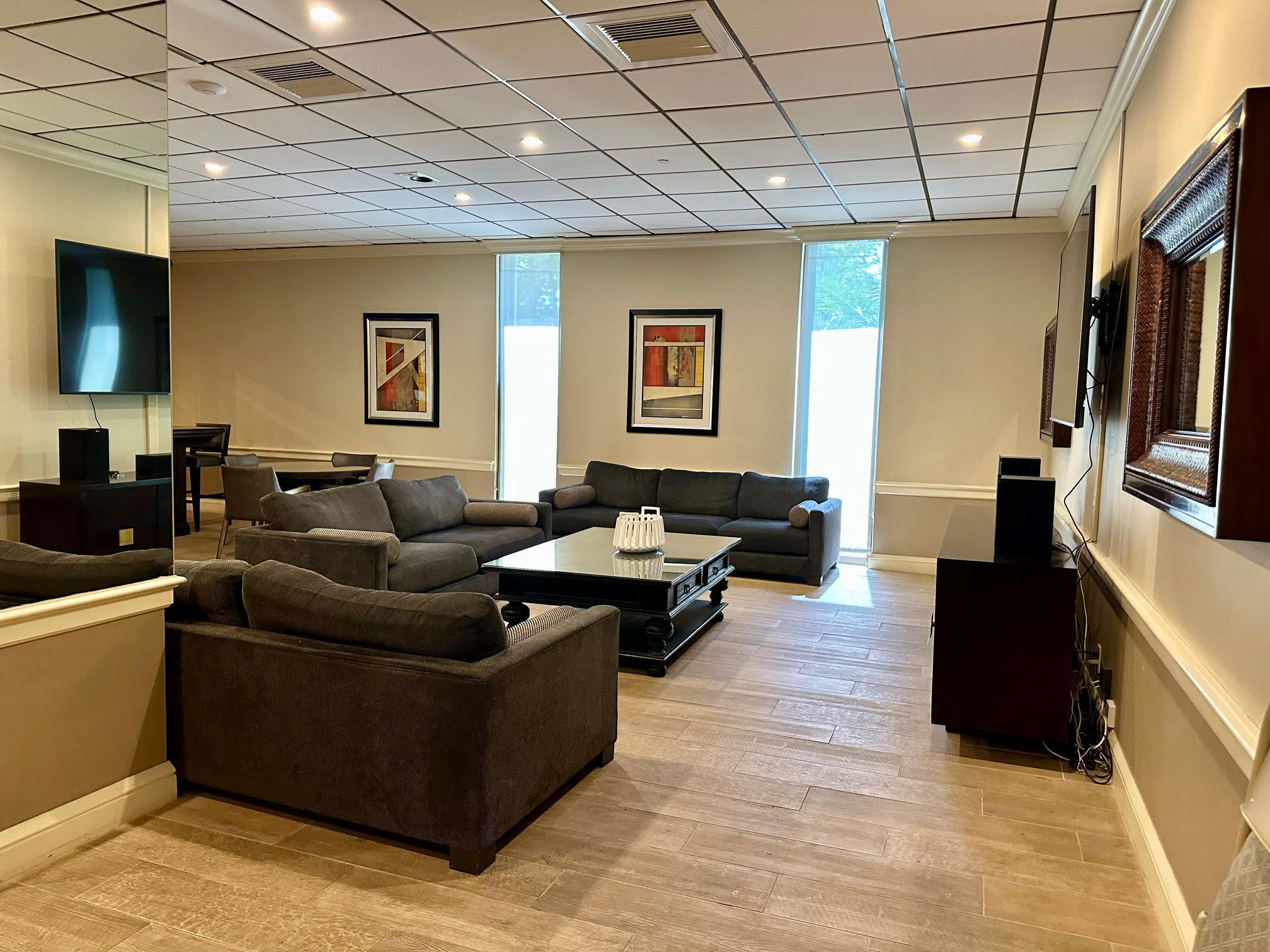 1900 South Ocean Boulevard, Unit 8G Pompano Beach, FL 33062 - Photo 44 of 54 a living room with furniture and a flat screen tv