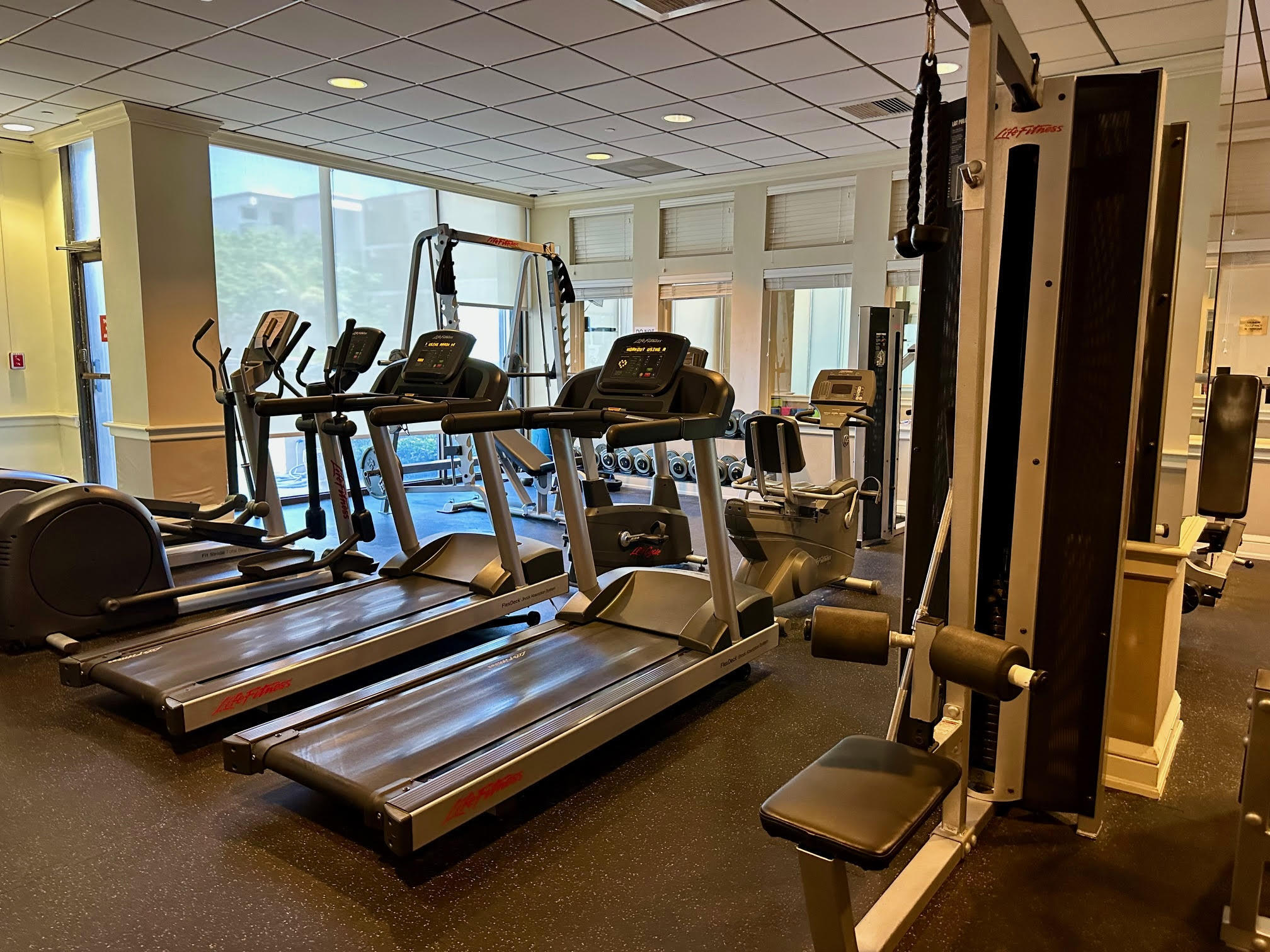 1900 South Ocean Boulevard, Unit 8G Pompano Beach, FL 33062 - Photo 45 of 54 a room with gym equipment and windows