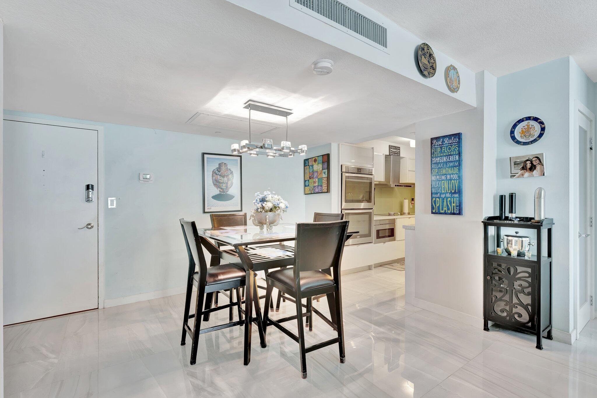 1900 South Ocean Boulevard, Unit 8G Pompano Beach, FL 33062 - Photo 6 of 54 a view of a dining room with furniture