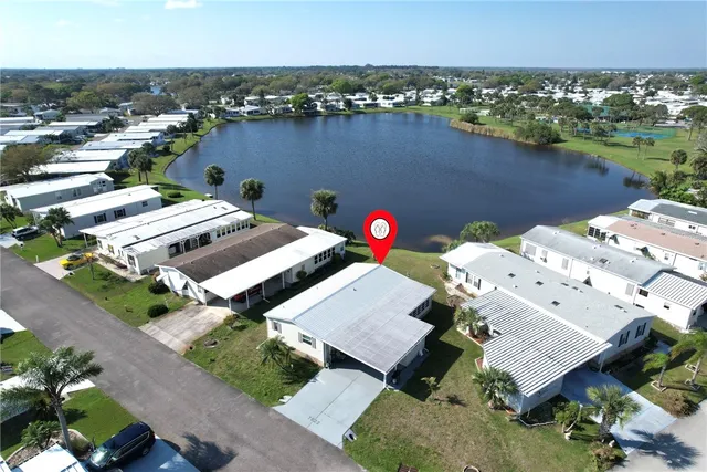 an aerial view of a house with a ocean view