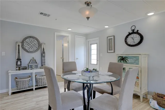 a view of a dining area with furniture and wooden floor