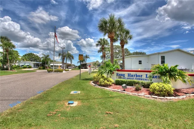 a view of street with houses and trees in the background