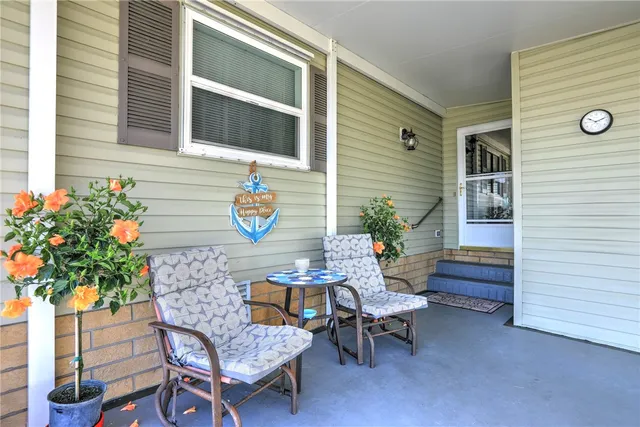 a balcony with furniture and flowers