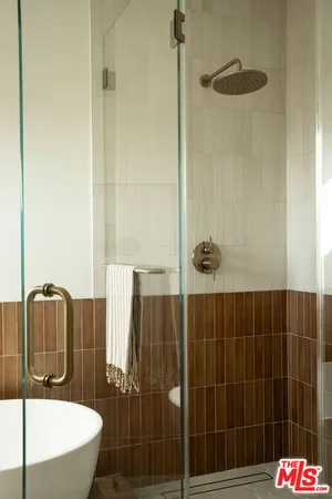 a bathroom with a bathtub and shower