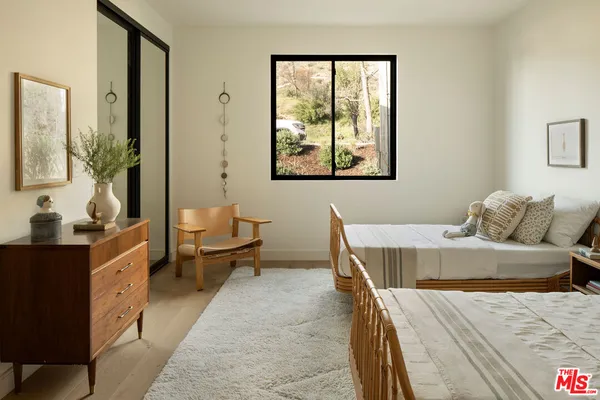 a living room with furniture and large window