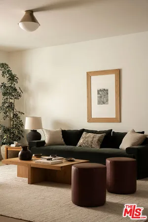 a living room with furniture and a potted plant