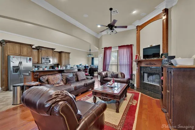 a living room with furniture and a fireplace