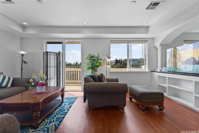 a living room with furniture and windows