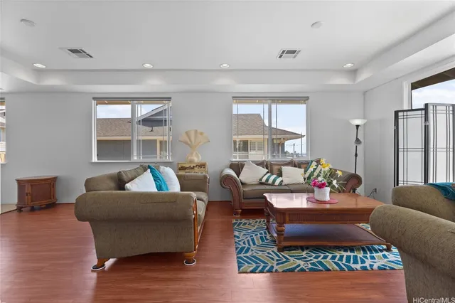 a living room with furniture rug and window