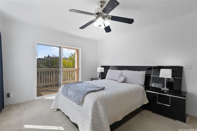 a bedroom with a bed and a tv